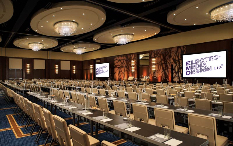 Event space lined with tables and chairs 