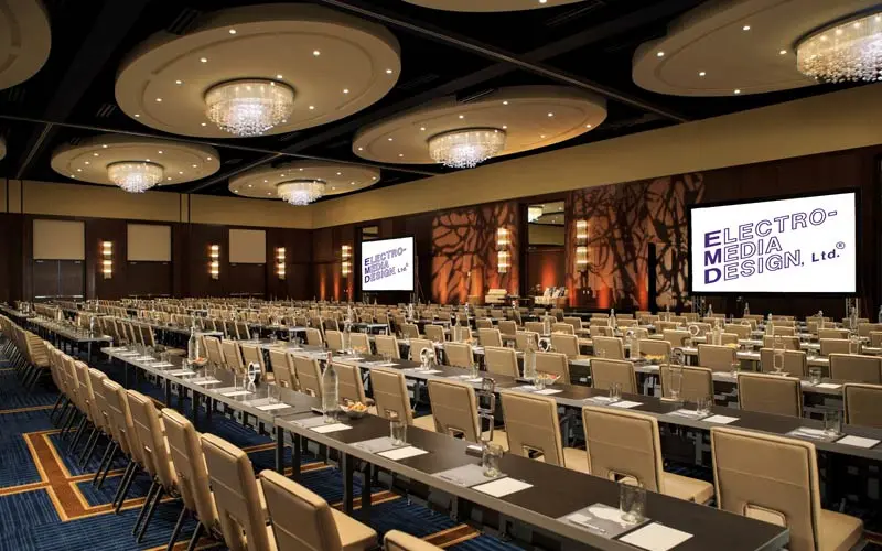 Event space lined with tables and chairs 